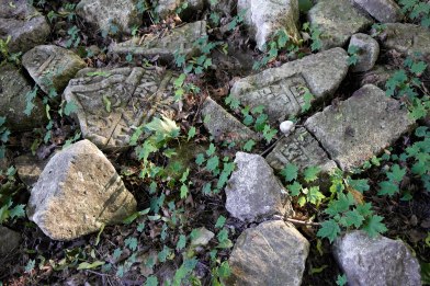 Fragments of gravestones at the site of the former Jewish cemetery