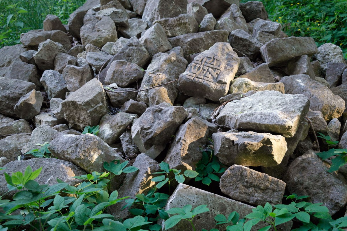 Fragments of gravestones at the site of the former Jewish cemetery